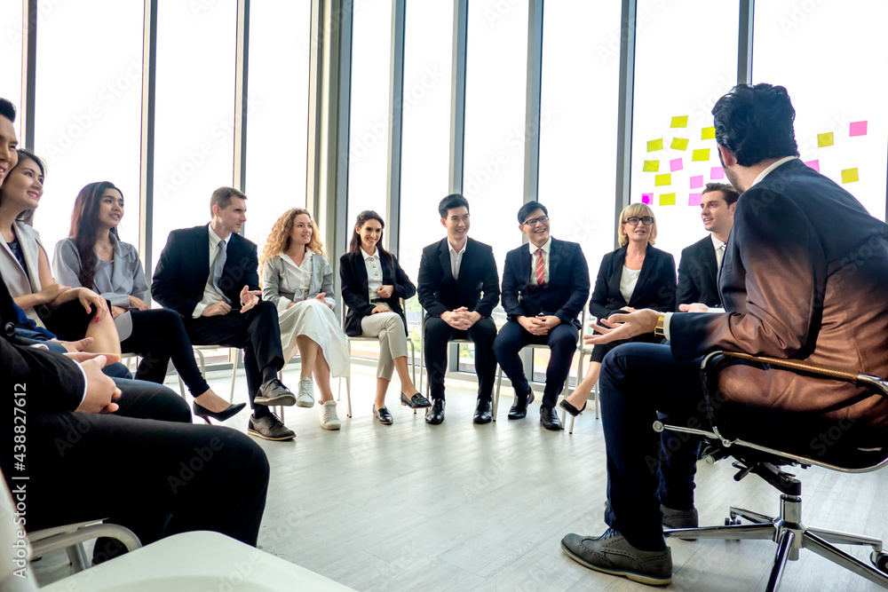 Shot of a group of businesspeople having a discussion in an office Shot of a group of businesspeople having a discussion in an office