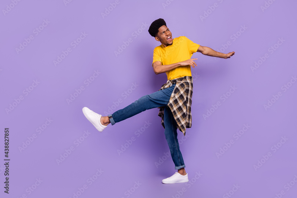 Full length body size view of attractive cool funky guy dancing having fun good mood rest isolated over violet purple color background