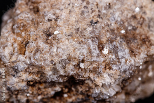 Macro mineral stone Albit on black background photo