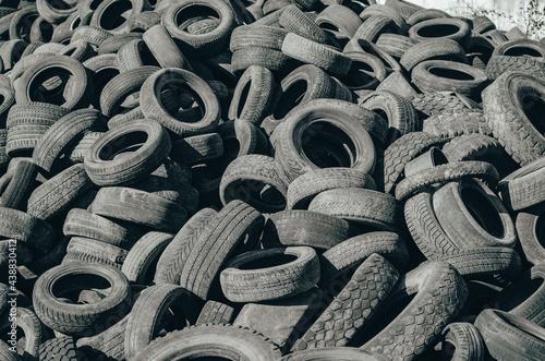 Landfill of old car tires torn spoiled abandoned