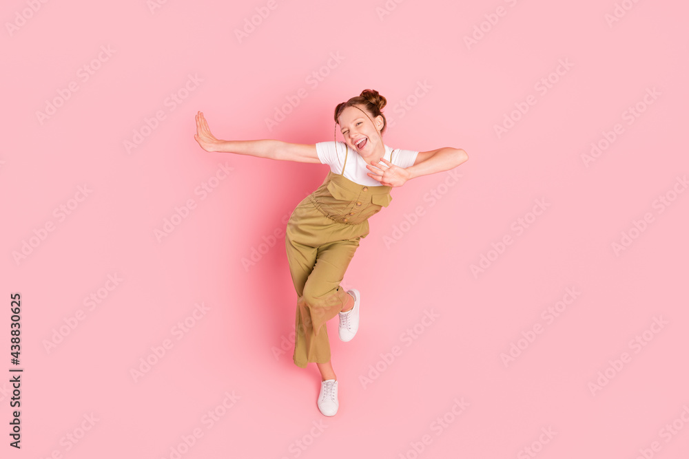 Full length body size view of attractive cheerful girl dancing fooling good mood isolated over pink pastel color background