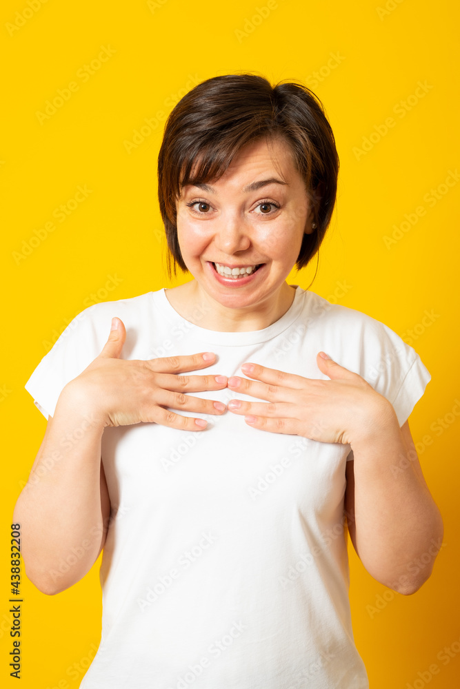 Emotional woman being happy that she was chosen to be leader. Surprised beautiful female pointing at herself.. Emotional woman being happy that she was chosen to be leader. Surprised beautiful female pointing at herself..