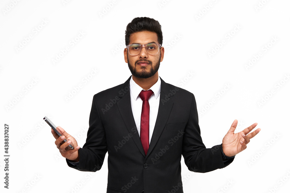 Portrait of surprised young indian business man with mobile phone on white isolated background Portrait of surprised young indian business man with mobile phone on white isolated background