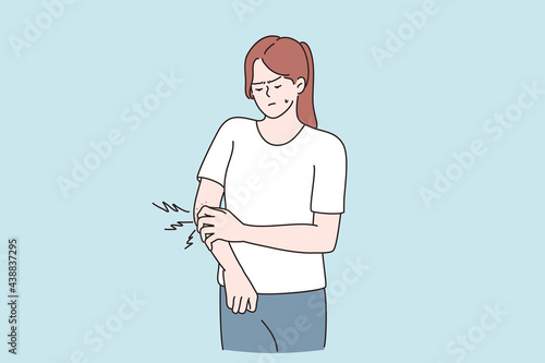 Itchy skin and allergy concept. Young displeased girl cartoon character standing touching irritated itchy skin having allergy or skin problems vector illustration  photo
