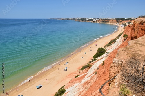 Fototapeta Naklejka Na Ścianę i Meble -  Red cliffs on the beach of Praia da Falesia near Albufeira, Algarve, Portugal
