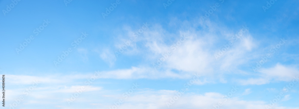sky panorama light blue with soft fluffy clouds and copy space