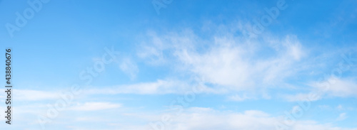 sky panorama light blue with soft fluffy clouds and copy space