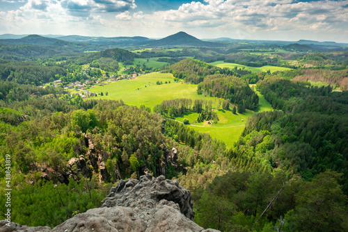 Epic view from Rock of Maria, or Mariina skala, or Marienfels into beautiful landscape of Bohemian Switzerland on a sunny summer day. View from the top of the rock into vast, picturesque landscape. photo
