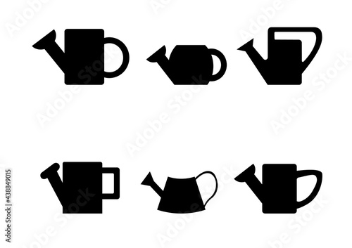 Black silhouettes of watering cans on white background