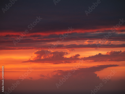 Beautiful burning clouds above the horizon during sunset © Eneko Aldaz