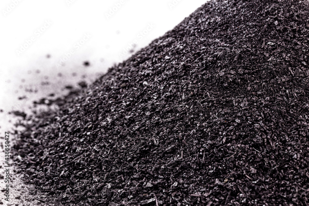 Ταπετσαρία graphite powder used in industry, black powder with isolated white background and copy space