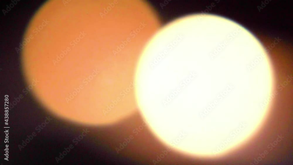 Flickering gold round flares created by candlelight Flickering gold round flares created by candlelight