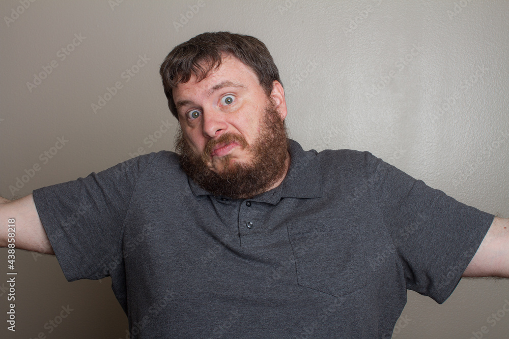 Man who could care less shrugging his shoulders Man who could care less shrugging his shoulders