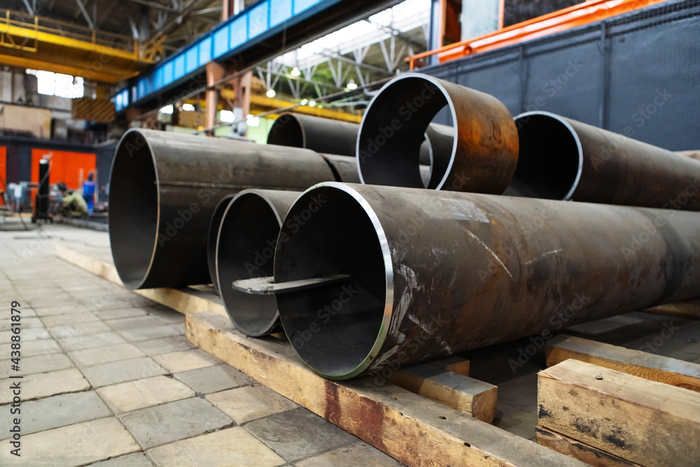 Production of large diameter steel pipes at a metallurgical plant. Soft focus. Close-up Production of large diameter steel pipes at a metallurgical plant. Soft focus. Close-up
