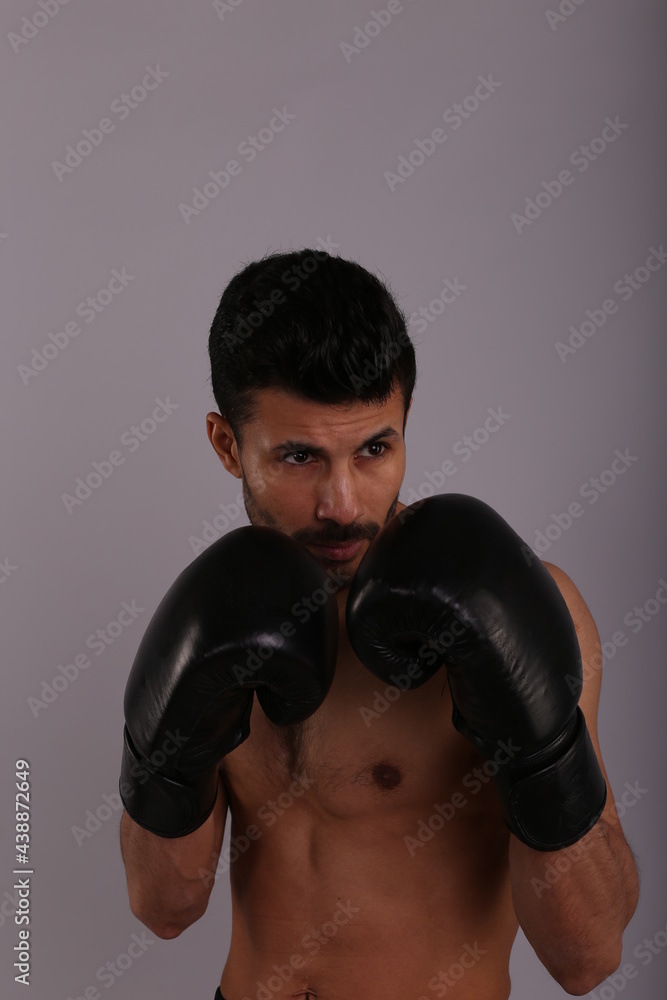 boxer in boxing gloves striking air