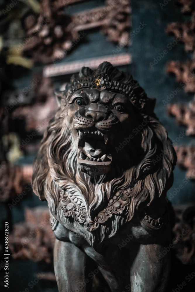 Stone statue of a roaring lion in Bali