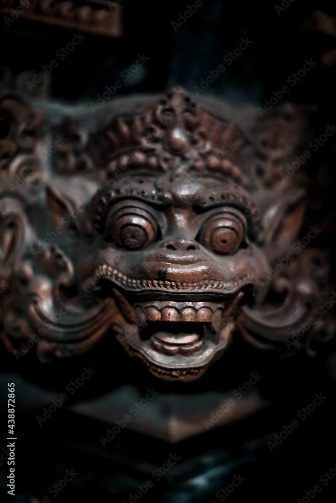 Balinese statue Stone figure of the God. Water Palace of Tirta Gangga in East Bali, Indonesia.