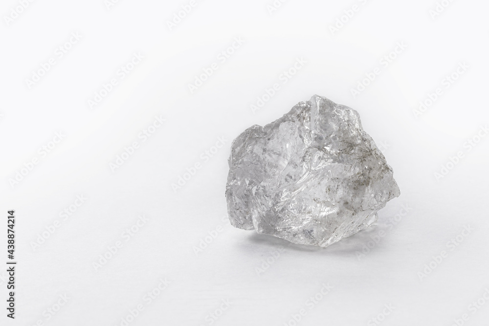 large rough diamond stone on isolated white background.