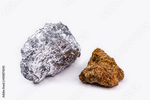 bauxite ore and aluminum stone together on isolated white background, industrial use ore.
