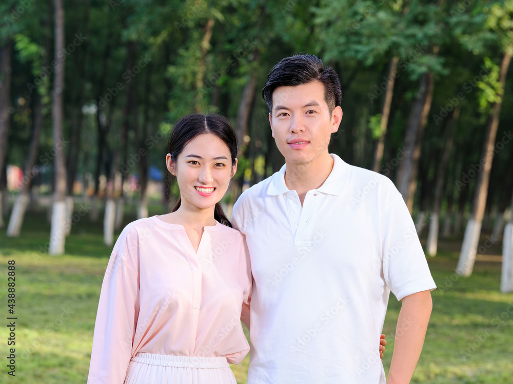 A happu Young couple in outdoor park A happu Young couple in outdoor park