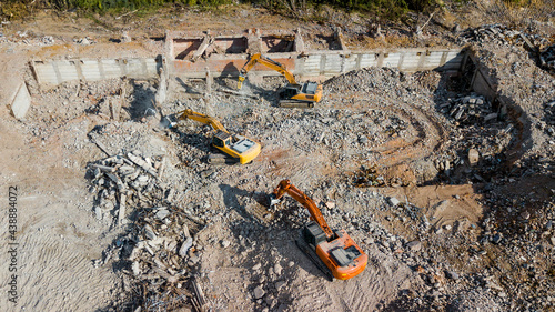 Excavator demolish building. View from above