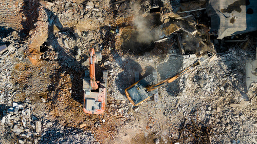 Fotografija Excavator demolish building. View from above