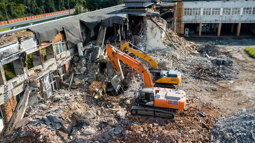 Excavator demolish building. View from above