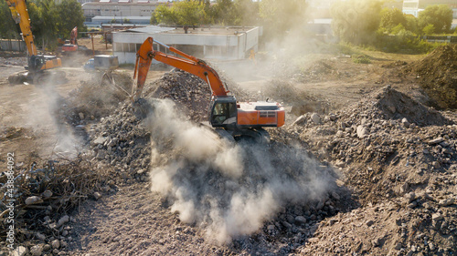 Excavator demolish building. View from above