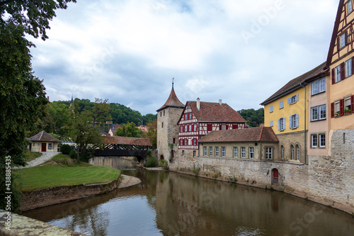 Wooden covered bridge and old tower in the historic center of Schw bisch Hall on the Kocher river  Baden-Wurttemberg  Germany.