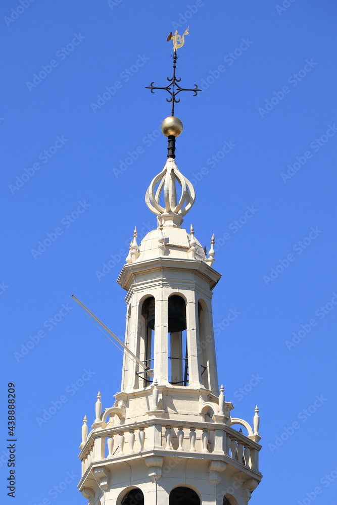 Fototapeta premium Amsterdam Montelbaanstoren Tower White Wooden Spire Detail Against a Blue Sky