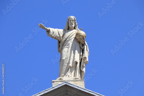 Amsterdam Mozes en Aaronkerk Church Roof Detail with White Blessing Christ Statue