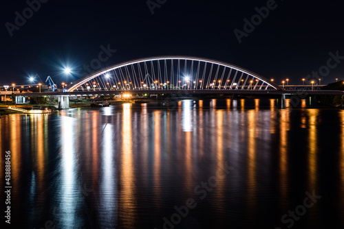 Nightscape of Apollo Bridge in Bratislava a road bridge over the Danube in the capital of Slovakia. © Dobroslav