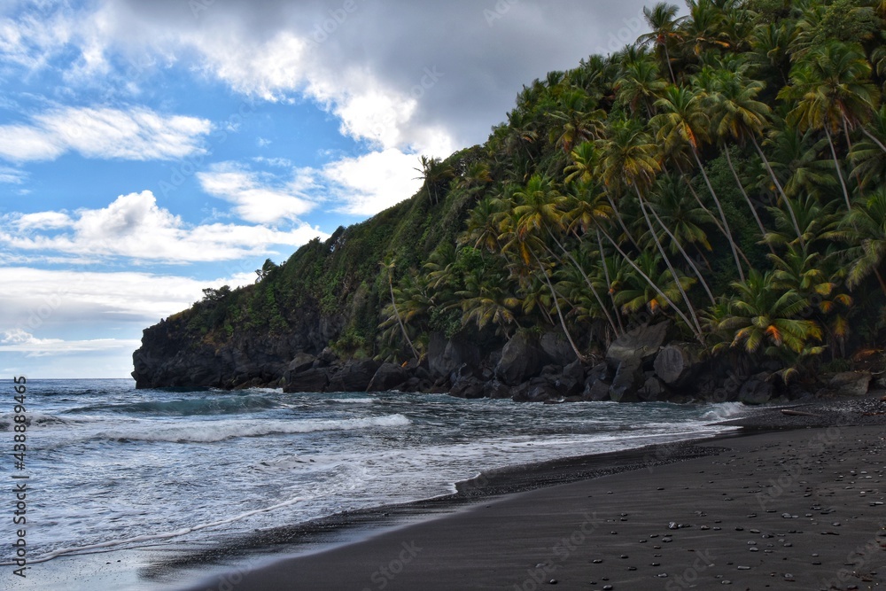 Byera, St. Vincent and the Grenadines-January 4, 2020: The beach on the Black Point National Park. The sand on the beach is black due to the volcanic composition of this Caribbean island.