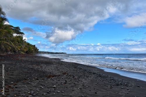 Byera, St. Vincent and the Grenadines-January 4, 2020: The beach on the Black Point National Park. The sand on the beach is black due to the volcanic composition of this Caribbean island. photo