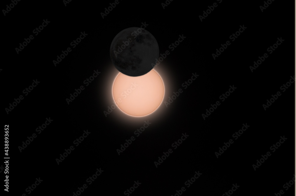 composed illustration of partial solar eclipse at maximum with dark moon in front on 10th of June 2021 near Trier, Germany composed illustration of partial solar eclipse at maximum with dark moon in front on 10th of June 2021 near Trier, Germany