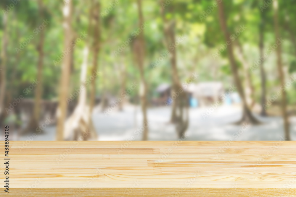 wood table top on blur beach and palm trees background wood table top on blur beach and palm trees background