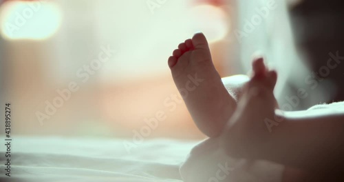 Wallpaper Mural Slow motion video newborn in a diaper wiggles legs in the early morning Torontodigital.ca