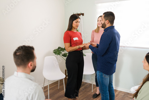 Therapist making a new exercise at group counseling photo