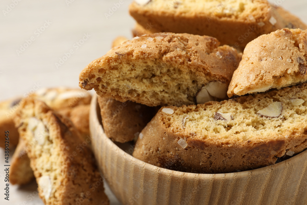 Traditional Italian almond biscuits (Cantucci) in bowl on table, closeup Traditional Italian almond biscuits (Cantucci) in bowl on table, closeup