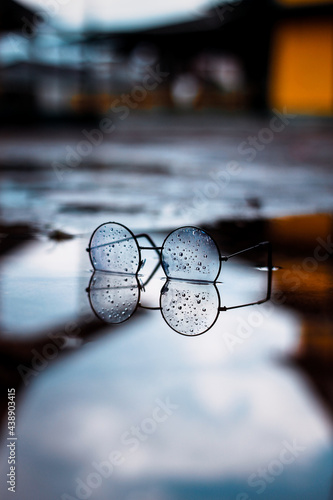 glasses drops on a puddle © Indra