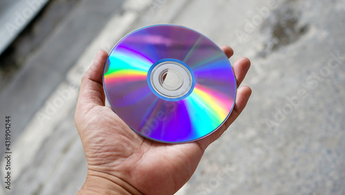 hand holding a cd