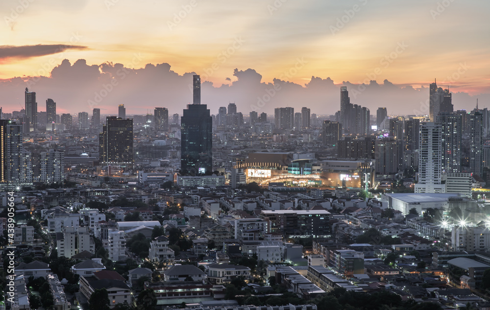 Fototapeta premium Bangkok, Thailand - Jun 01, 2021: Aerial view of Beautiful scenery view of Skyscraper Evening time Sunset creates relaxing feeling for the rest of the day. Selective focus.