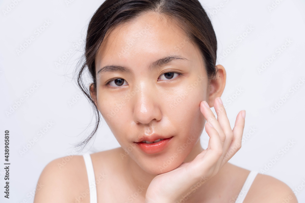 Beautiful young asian woman with clean fresh skin on white background. Asian women portrait. Beautiful young asian woman with clean fresh skin on white background. Asian women portrait.