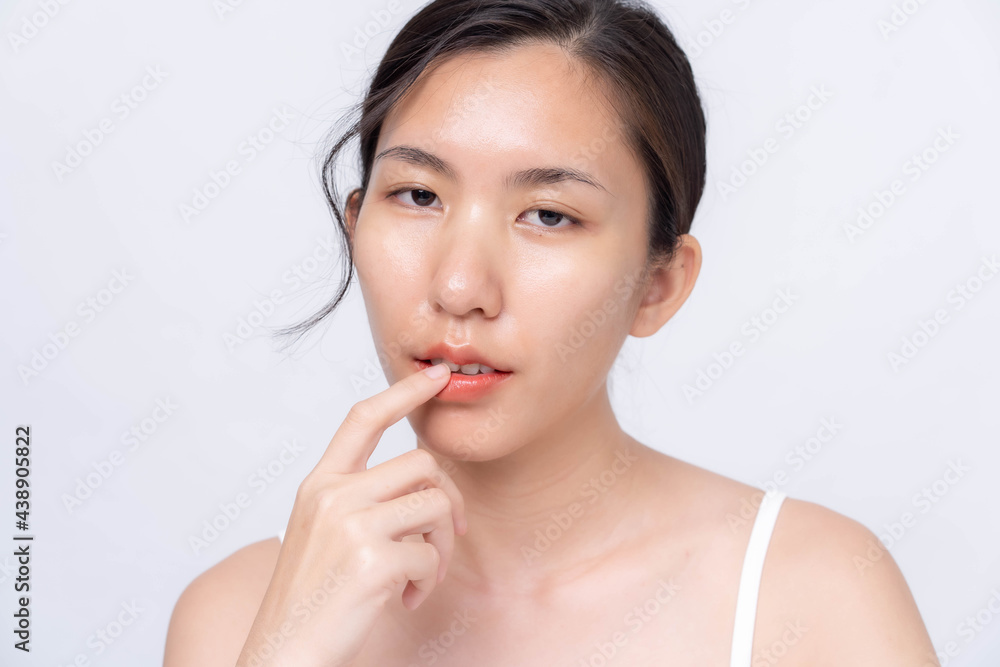Beautiful young asian woman with clean fresh skin on white background. Asian women portrait. Beautiful young asian woman with clean fresh skin on white background. Asian women portrait.
