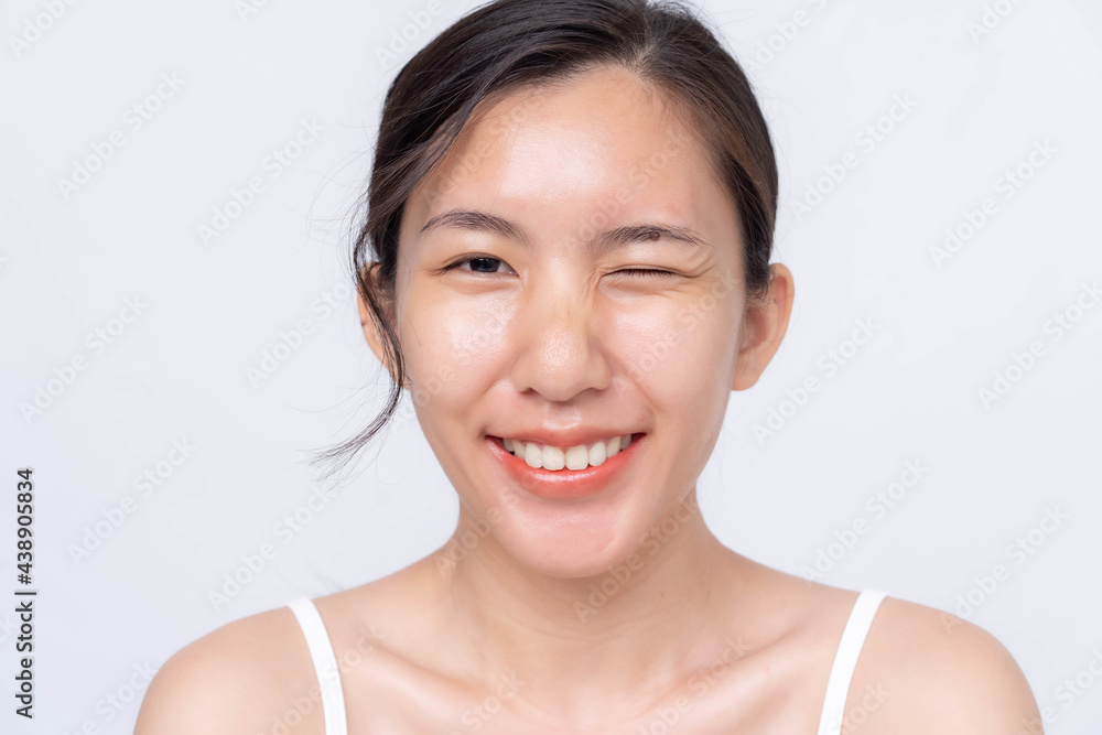 Beautiful young asian woman with clean fresh skin on white background. Asian women portrait. Beautiful young asian woman with clean fresh skin on white background. Asian women portrait.