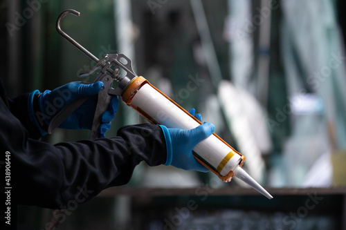 Bild auf Leinwand Craftsmen are using silicone adhesives for general and industrial applications