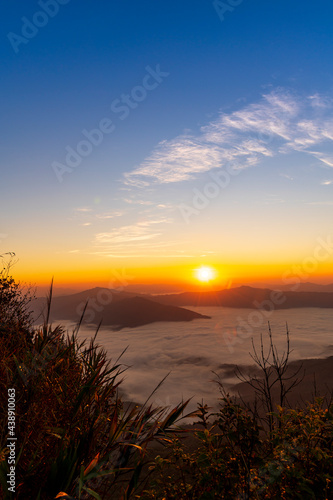 Sunrise / Sunset Landscape of the mountain and sea of mist in winter sunrise view from top of Doi Pha Tang mountain , Chiang Rai, Thailand