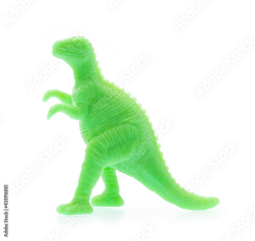 Scary Dinosaur made out of plastic. Dinosaur toy isolated on white background photo