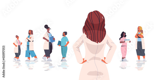 team of medical professionals mix race women doctors in uniform working together medicine healthcare concept