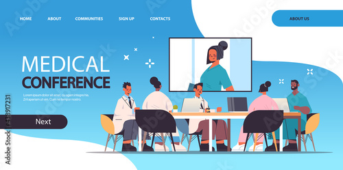 team of doctors having video conference mix race medical professionals discussing at round table medicine healthcare